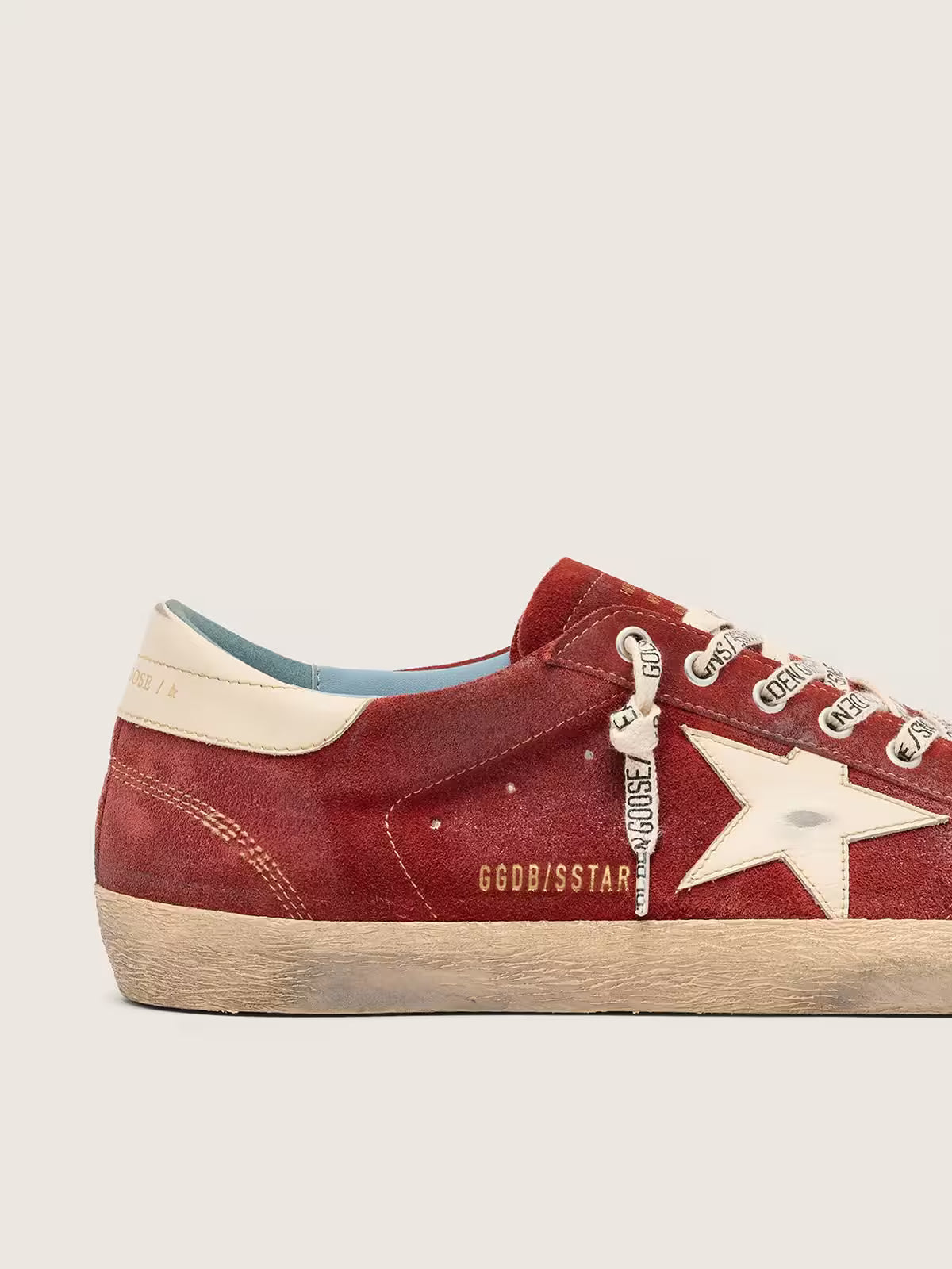 Star in red suede with cream leather