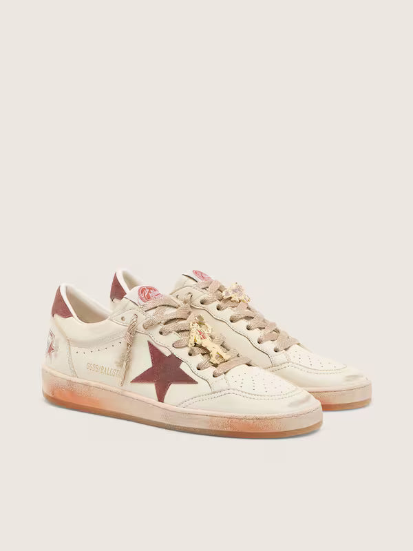 Star in white leather with rust leather